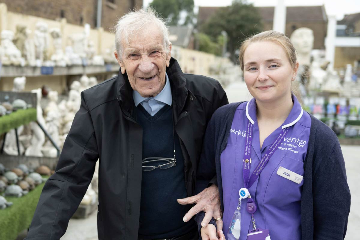 Avante Care and Support – Care Homes 033 Resident and Avante Care Worker at a garden centre smiling
